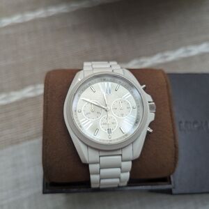 Women's white Michael Kors watch.